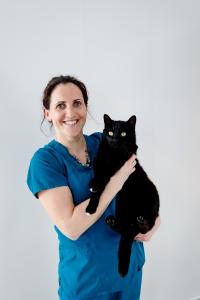 Kate Allgood holding a big black cat called Jack